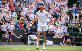 Serbia's Novak Djokovic celebrates beating Canada's Denis Shapovalov in their men's singles semi-final match on the eleventh day of the 2021 Wimbledon Championships at The All England Tennis Club in Wimbledon, southwest London, on July 9, 2021.