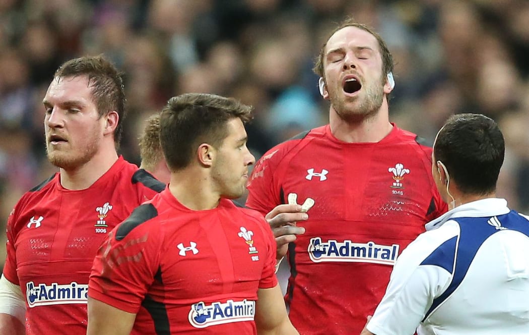 Alun Wyn Jones speaks to referee Jaco Peyper during Wales Six Nations rugby match against France in Paris.
