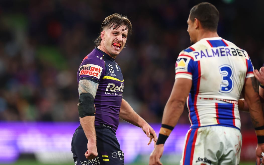 MELBOURNE, AUSTRALIA - JUNE 05: Cameron Munster of the Storm gestures towards Dane Gagai of the Knights after winning the round 14 NRL match between Melbourne Storm and Newcastle Knights at AAMI Park, on June 05, 2026, in Melbourne, Australia. (Photo by Daniel Pockett/Getty Images)