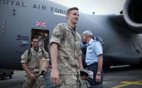 Personnel being welcomed back to New Zealand after stepping off the plane.