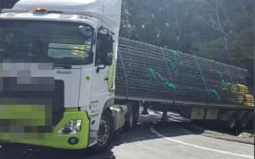 The truck got struck at a hairpin bend on Cove Road, sparking hours of traffic chaos.