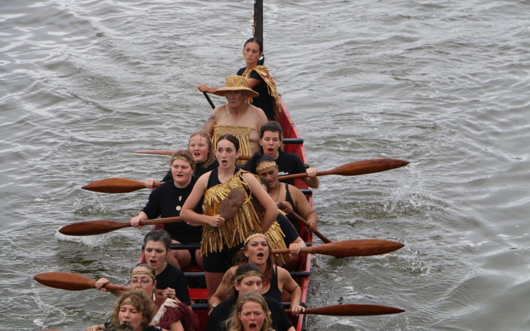 The waka flotilla makes it way to Te Tii beach on Waitangi Day.