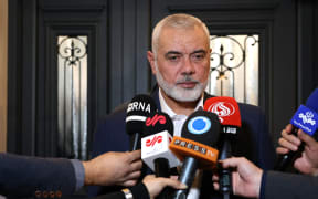 This handout picture provided by the Iranian foreign ministry on December 20, 2023, shows Qatar-based Hamas leader Ismail Haniyeh speaking to journalists as he welcomes the Iranian foreign minister (not in the picture), in Doha. (Photo by Iranian Foreign Ministry / AFP) / XGTY / XGTY / === RESTRICTED TO EDITORIAL USE - MANDATORY CREDIT "AFP PHOTO / HO / IRANIAN FOREIGN MINISTRY" - NO MARKETING NO ADVERTISING CAMPAIGNS - DISTRIBUTED AS A SERVICE TO CLIENTS ===