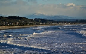 Southern Alps are seen behind Greymouth.