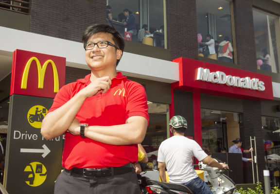 Henry Nguyen outside Vietnam's first McDonald's restaurant.