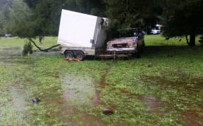 An area that turned into a river and swept the white chiller downstream. The car was submerged to its windows