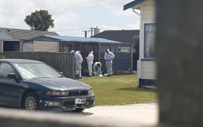 Forensic teams at the Hawera property.