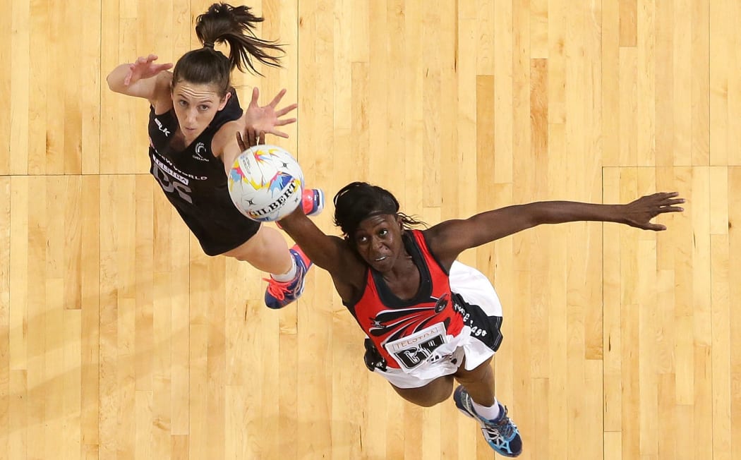 Bailey Mes of New Zealand and Kielle Connolly of Trinidad & Tobago compete for the ball.