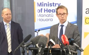 Medsafe group manager Chris James (left) and Director-General of Health Ashley Bloomfield speaking on the Pfizer-BioNTech vaccine provisional approval.