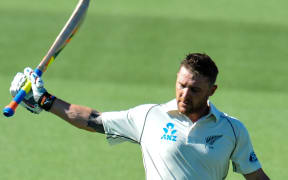 The Black Caps captain Brendon McCullum raises his bat to the crowd.