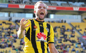 Jeremy Brockie celebrates scoring the first of his two goals in his last Phoenix game