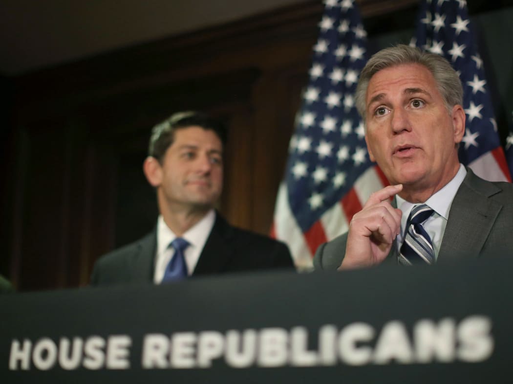 US House Majority Leader Kevin McCarthy, right, speaks to the media while flanked by House Speaker Paul Ryan in Washington on 3 November.