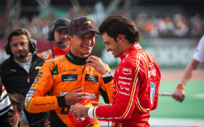 Lando Norris of McLaren and Carlos Sainz of Ferrari, 2024.