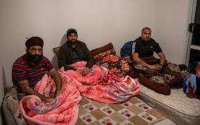 Workers are crammed into small rooms in an Auckland house.