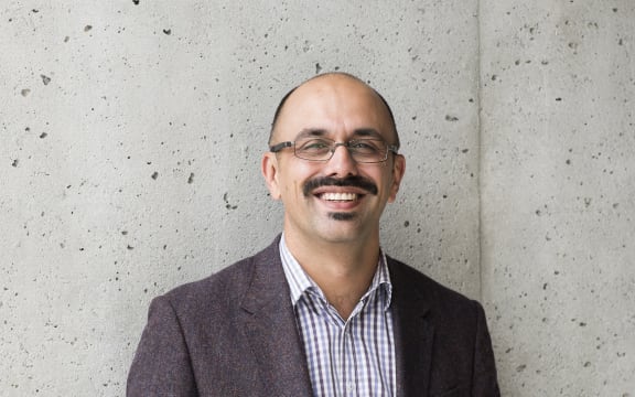 A portrait of journalist Ali Ikram.