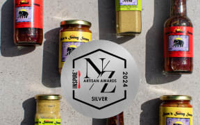 Image with  a number bottles and labels featuring Thai elephant drawing