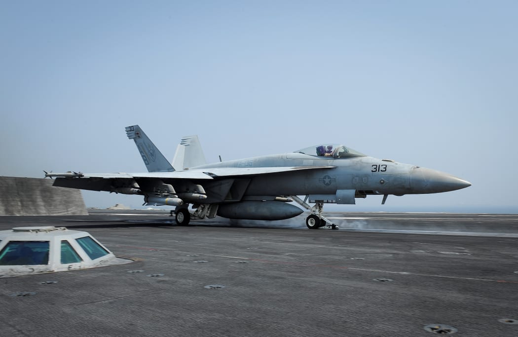 An F/A-18E Super Hornet launches from aircraft carrier USS Theodore Roosevelt on 21 August 2015 in the Gulf, as part of the US-led coalition's operations in Iraq and Syria.
