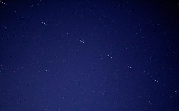 The Starlink 3 train rides across the early morning sky, accompanied by a handful of other satellites.