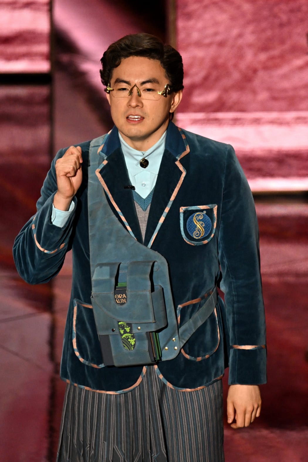 US comedian Bowen Yang presents the award for Best Costume Design onstage during the 97th Annual Academy Awards at the Dolby Theatre in Hollywood, California on March 2, 2025. (Photo by Patrick T. Fallon / AFP)