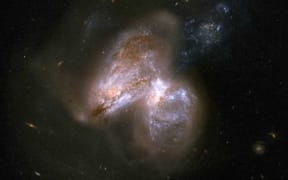 The real monster black hole is revealed in this new image from NASA's Nuclear Spectroscopic Telescope Array of colliding galaxies - Arp 299.