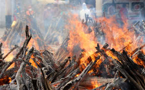 India's second Covid-19 wave has had a devastating human toll. Funeral pyres in New Delhi.