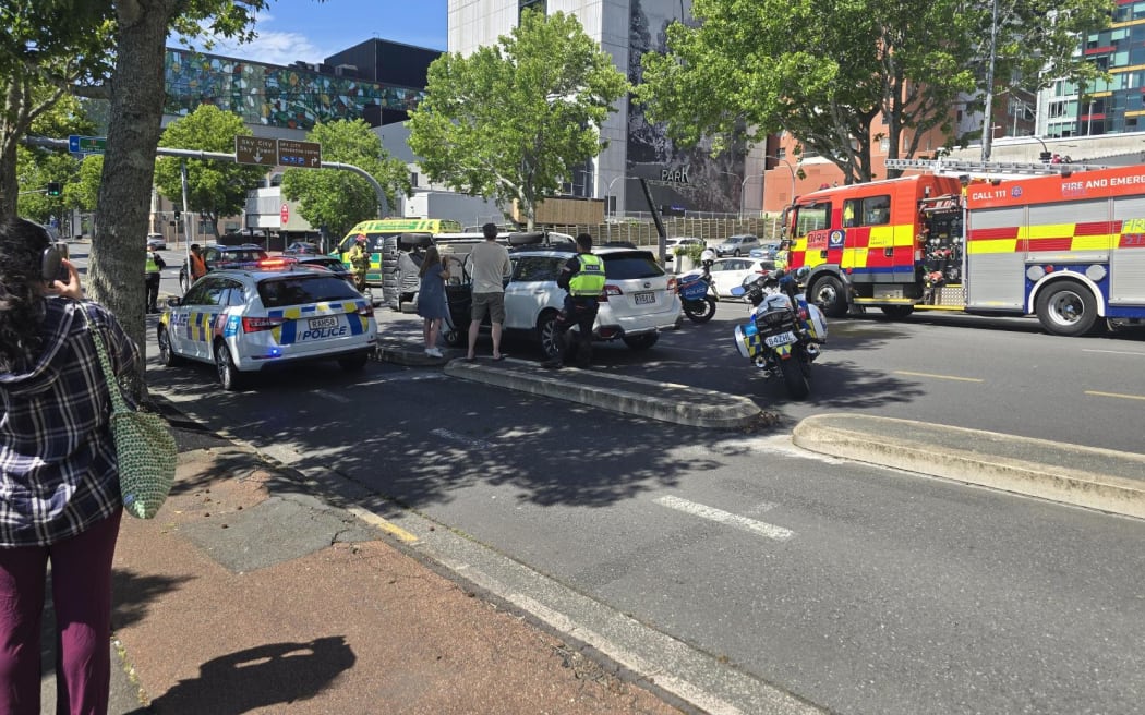 A car is on its side after a crash on Auckland's Nelson Street.