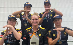 The five Tawa College alumni after the Welllington Blaze won the domestic T20 final in February 2022, making the 'T' for Tawa hand signal. Melie (left) and Jess Kerr (back row). From left to right (front row) Georgia Plimmer, Rebecca Burns and Sophie Devine.