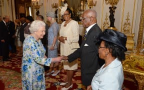The Queen shakes hands with the Governor-General of Barbados, Elliott Belgrave, during a reception ahead of the Governor General's lunch in honour of the Queen's 90th birthday at Buckingham Palace in London, June 10, 2016.