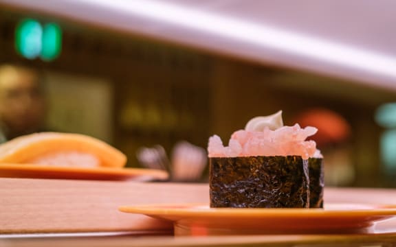 Plates of sushi on a conveyor belt at a sushi chain restaurant in Tokyo on 3 February, 2023.