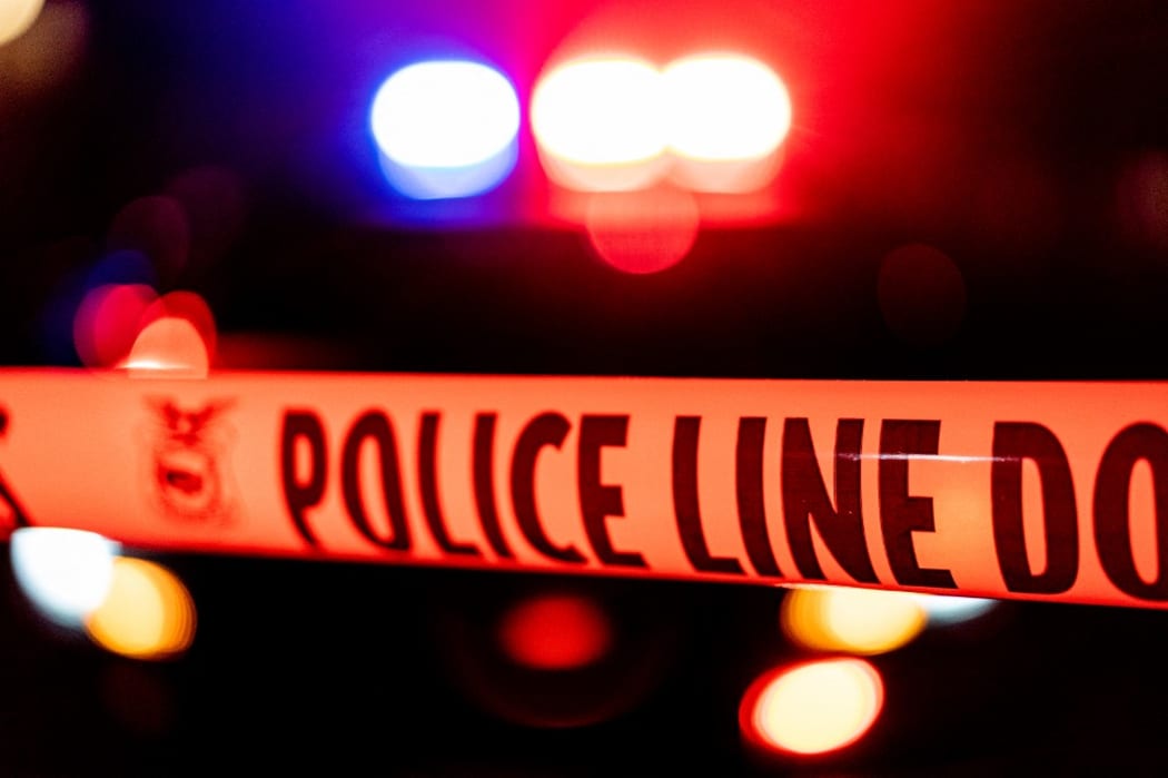 Police tape blocks off a US crime scene.
