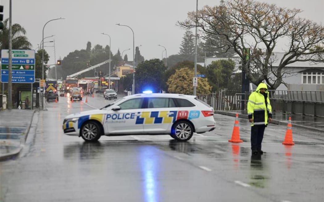 A section of road in Blockhouse Bay, Auckland has been closed after wind blew the roof off a commercial building and partially collapsed the front of the structure.