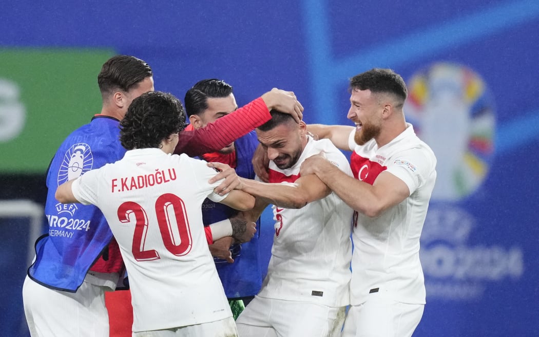 Merih Demiral celebrates after scoring his side's second goal during the UEFA EURO 2024 round of 16 match between Austria and Turkiye at Football Stadium Leipzig on July 2, 2024 in Leipzig, Germany.
