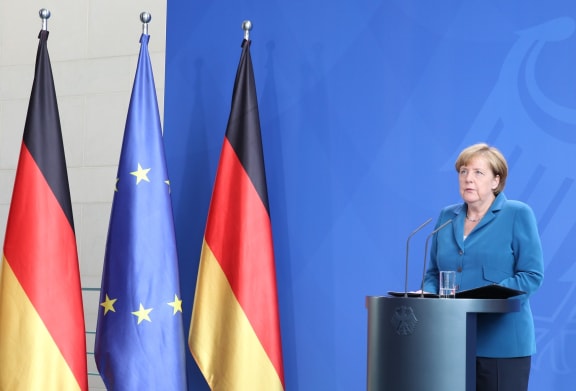 German Chancellor Angela Merkel speaks during a press conference after the Munich shooting.