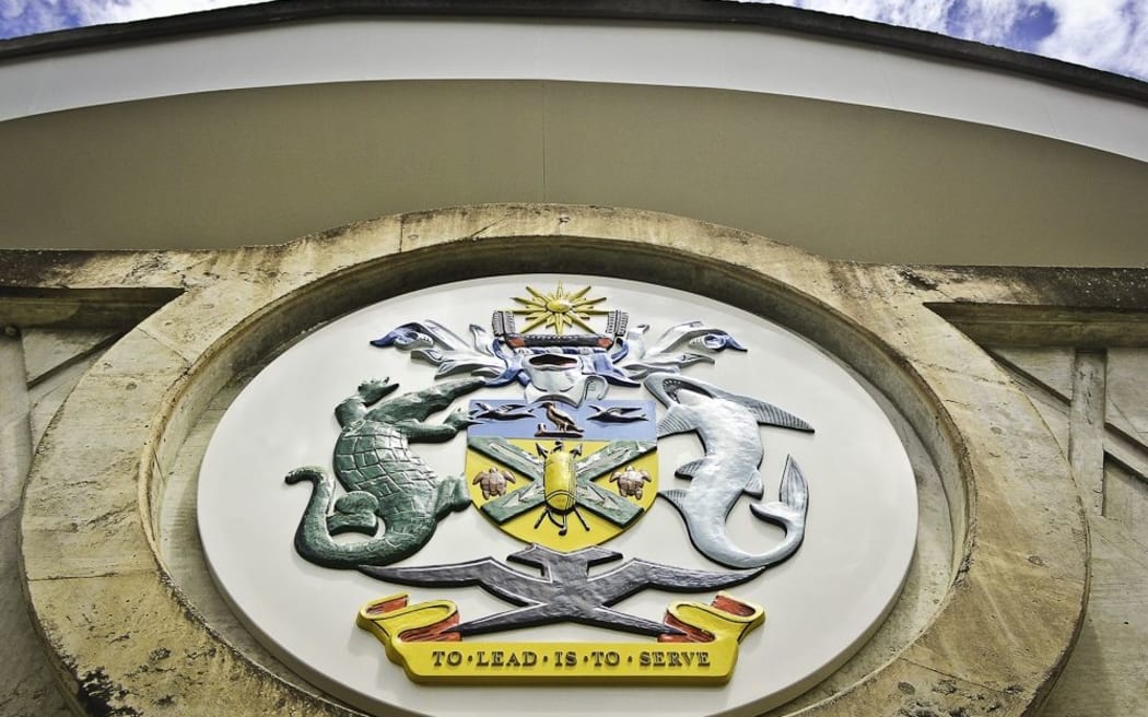 The Solomon Islands Coat of Arms adorns the steps of the National Parliament.
