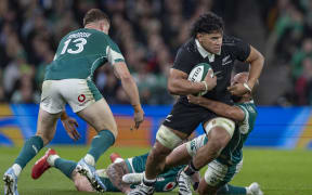 All Black Wallace Sititi is tackled by Jamison Gibson-Park of Ireland during All Blacks v Ireland.