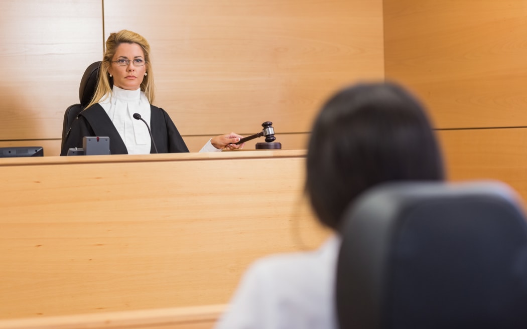 Lawyer listening to the judge in the court room