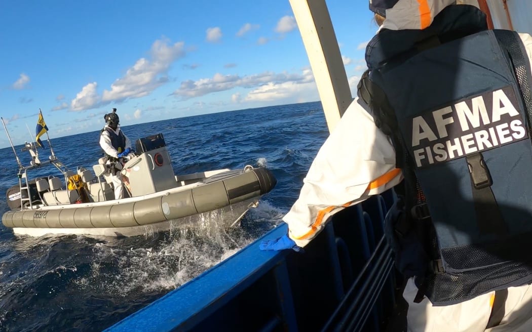 Starboard Maritime Intelligence surveillance technology - AFMA - ship being boarded in unknown location