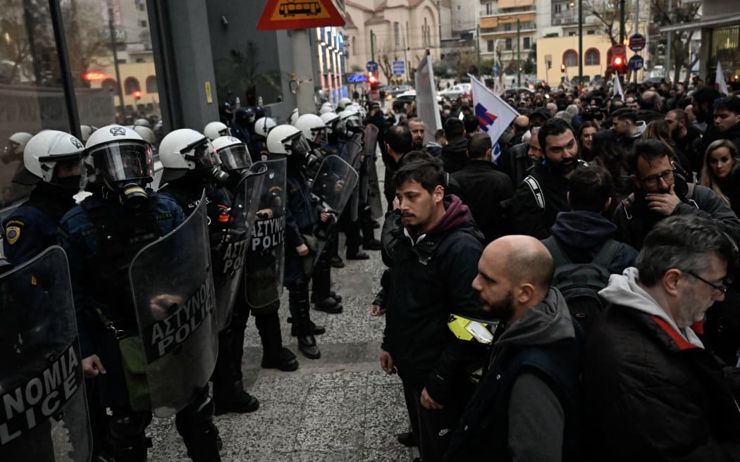 Riot police forming a security cordon in front of the Hellenic Train headquarters in Athens, during a protest by about 700 demonstrators after the country's worst-ever rail disaster. 2 March, 2023.