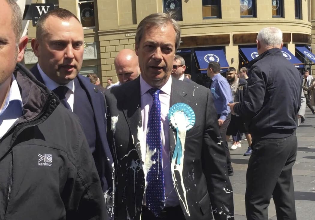 Brexit Party leader Nigel Farage after being hit with a milkshake during a campaign walkabout for the upcoming European elections in Newcastle, England, Monday May 20.