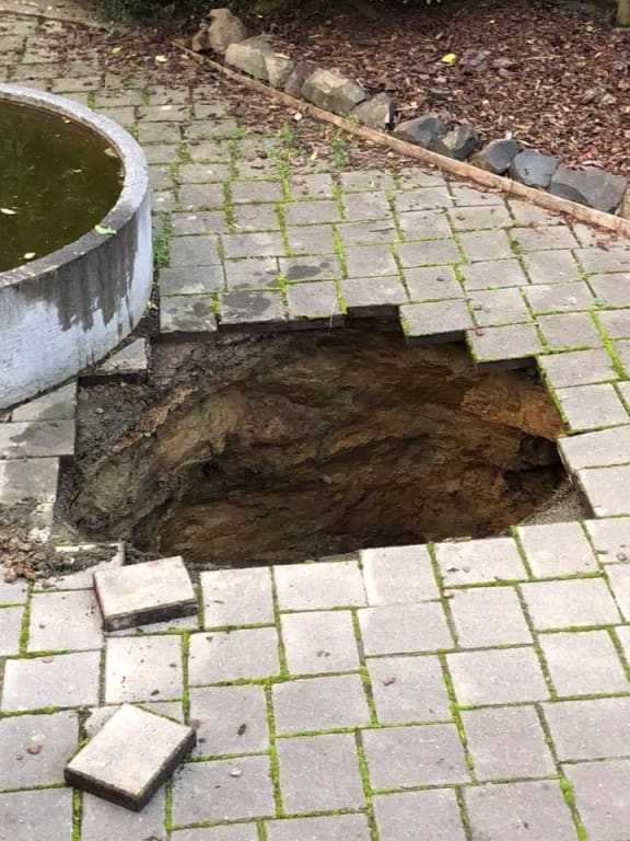 The hole in the patio at Andrew Thomson's Otago home.