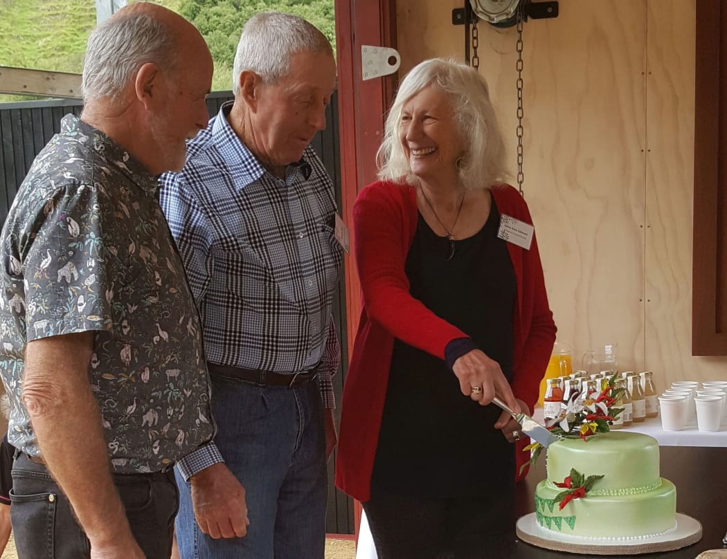 Jeremy Salmond (left) and Dame Anne Salmond (right) help cut a cake to celebrate the 40th birthday of the Queen Elizabeth II National Trust.