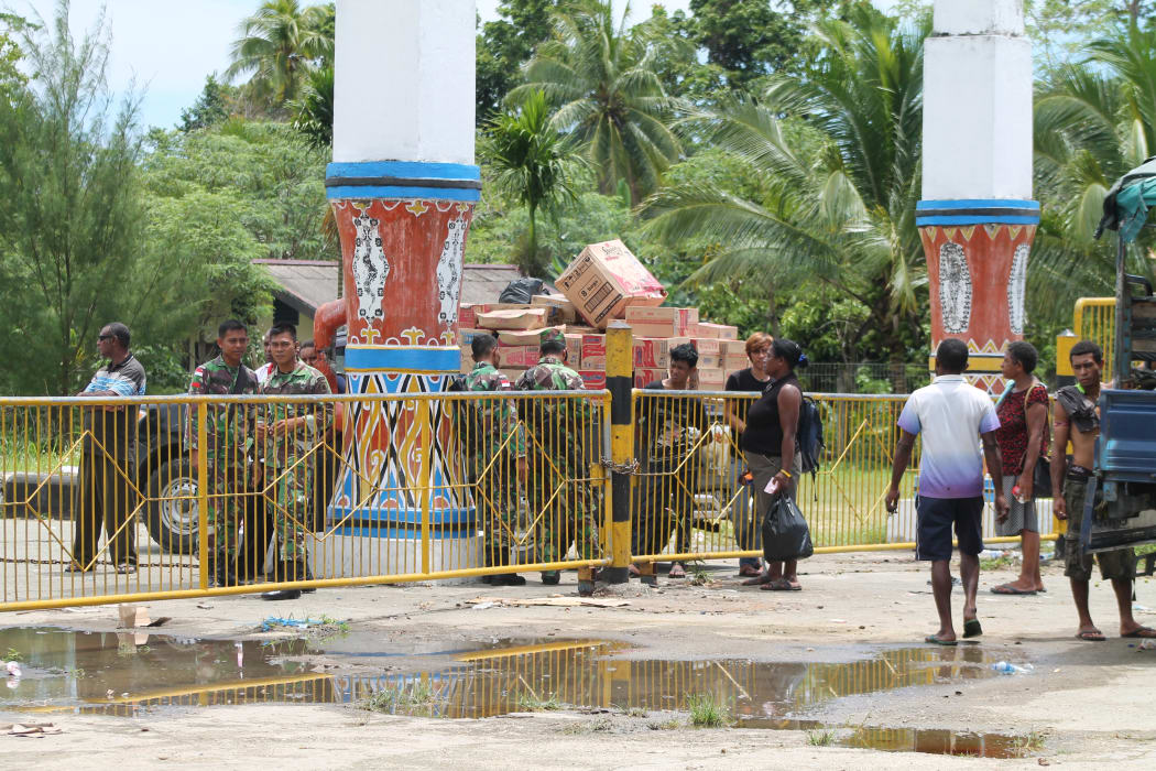 Indonesian military guard the border with Papua New Guinea at Wutung,