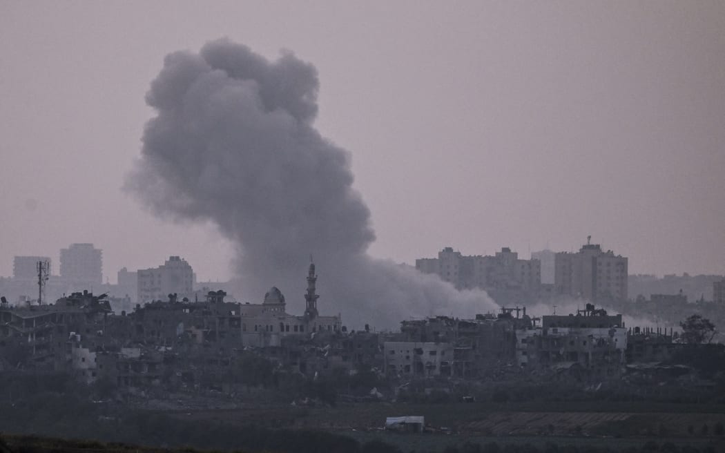 A picture taken from Israel's southern city of Sderot shows smoke billowing during an Israeli airstrike on the northern Gaza Strip on October 24, 2023, amid ongoing battles between Israel and the Palestinian group Hamas.