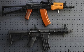 Semi-automatic weapons are on display at a gun shop in the Iraqi Shiite holy city of Najaf on April 15, 2019.