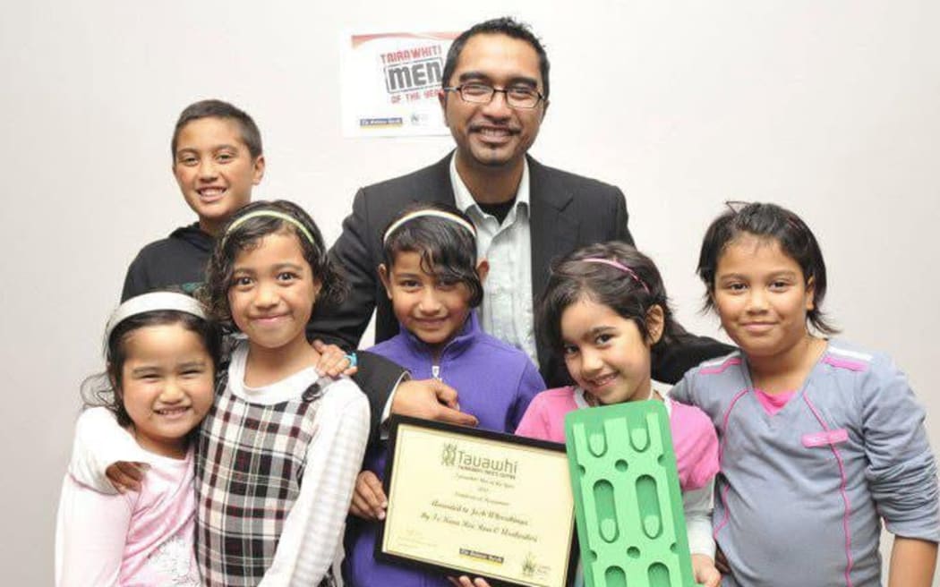 Josh Wharehinga with his children and award at the 2011 Tairawhiti Man of the Year Awards hosted by Tauawhi Men's Centre. Wharehinga says he has always been a father first and councillor second.