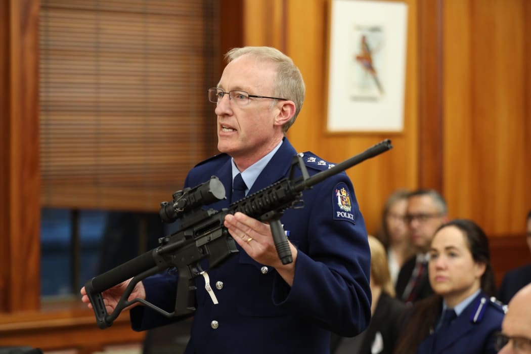 Mike McIlraith is the officer in charge of the Arms Act service delivery group with an AR15 military style rifle.