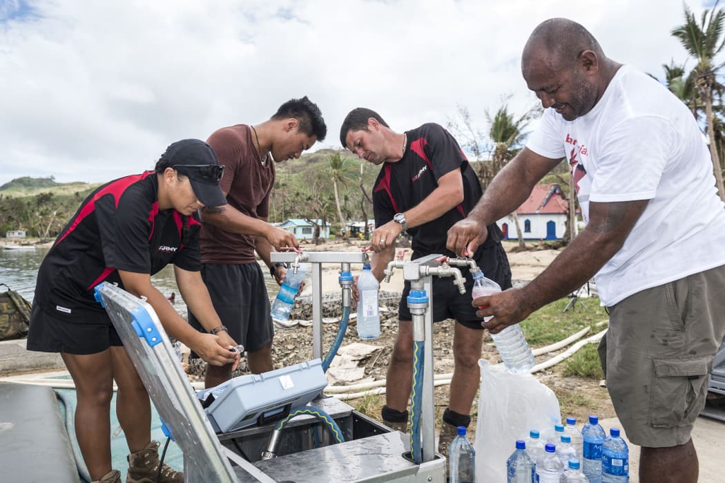 New Zealand army engineers help at a water desalination operation in Lomaloma village, Fiji after cyclone Winston.