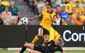 Mary Fowler (top) of the Matildas and Katie Bowen of New Zealand during the International friendly match between the Australian Matildas and the New Zealand Football Ferns at QCB Stadium in Townsville, 8 April, 2022.