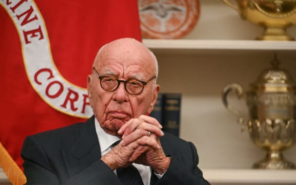 Rupert Murdoch looks as US President Donald Trump speaks to the press after signing an executive order to create a US sovereign wealth fund, in the Oval Office of the White House on February 3, 2025, in Washington, DC.