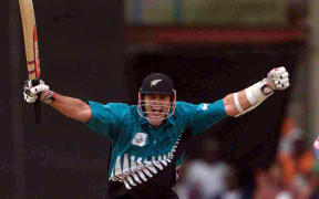 Chris Cairns celebrates hitting the winning run during the ICC Knockout trophy Final between New Zealand and India in Nairobi, 15 October, 2000